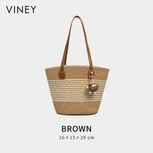 Brown striped woven straw tote with plush charm, front view and 26 × 15 × 29 cm dimensions