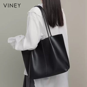 VINEY Black Leather Tote and Pouch Set in black, lifestyle view