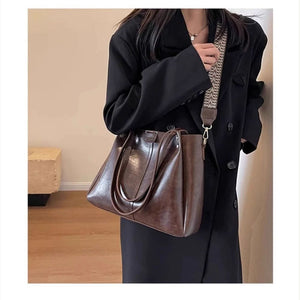 VINEY Coffee Leather Convertible Tote Bag in coffee, close carry