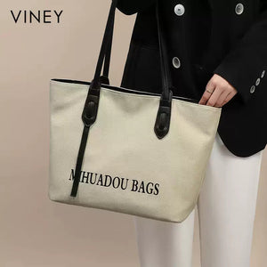 VINEY Ivory Canvas Commuter Tote Bag in ivory, model view