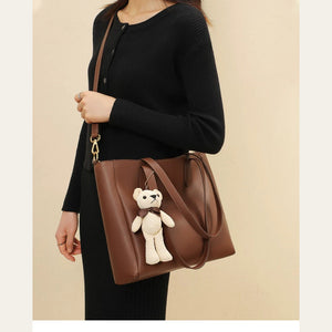 VINEY Leather Commuter Tote Bag with Bear Charm in caramel, lifestyle view
