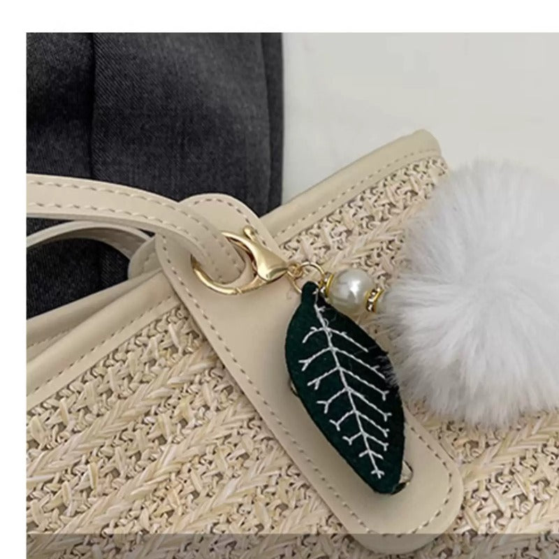 Close-up of woven texture and charm