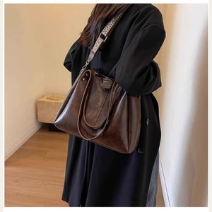 VINEY Coffee Leather Convertible Tote Bag in coffee, angled lifestyle