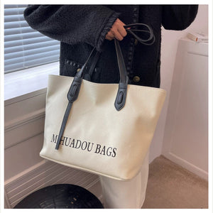 VINEY Ivory Canvas Commuter Tote Bag in ivory, lifestyle view