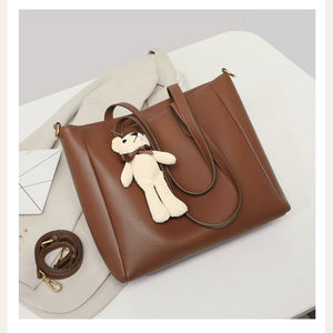 VINEY Leather Commuter Tote Bag with Bear Charm in caramel, studio view