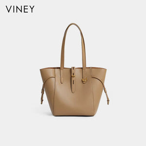 VINEY Winged Leather Bucket Tote Bag in brown, studio front